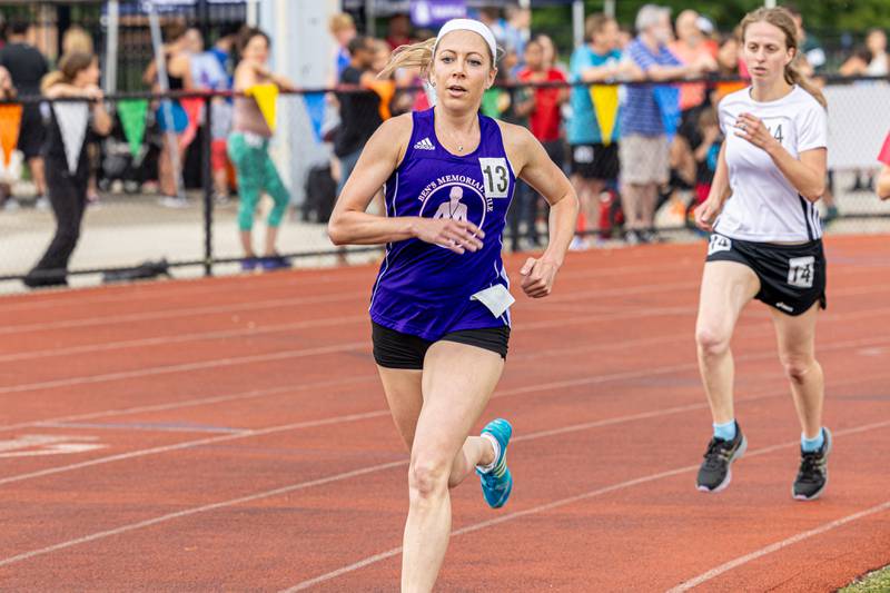 Heather Childs (left) and Veronica Montague (right) run at Ben’s Memorial Mile, a community festival held every summer to raise money and awareness for mental health and suicide prevention in honor of Ben Silver, on Saturday, July 22, 2023.