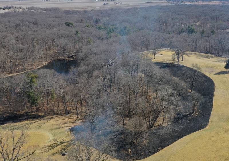 Crews burn off part of the green area for a controlled burn on Monday, March 2, 2026 at Deer Park Golf Club in Oglesby.