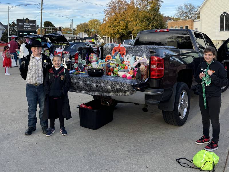Blaise, Sylvia and Melady with their trunk at the First Presbyterian Church's Trunk-or-Treat. The trunk's theme was I-Spy.