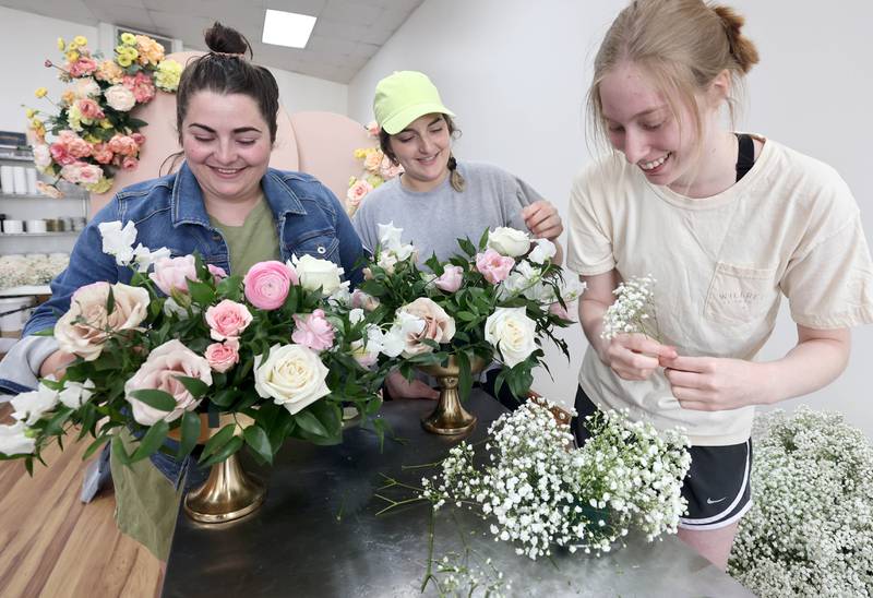 Willrett Flower Company Owners Kat Willrett (left) and her sister Mary Grace McCauley with some arrangements they put together Friday, May 13, 2022, at the store at 302 E. Lincoln Highway in DeKalb. The location will soon be filled with flowers and gift items as they get ready for the opening in June.