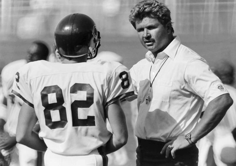 Chicago Bears head coach Mike Ditka talks with wide receiver Ken Margerum during training camp on Wednesday, June 12, 1985 in Platteville Wis.