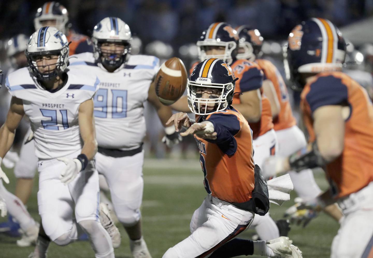 Buffalo Grove's Michael Cervantes (8) toss the football to a back during the IHSA Class 7A football playoffs Saturday November 6, 2021 at Buffalo Grove High School.