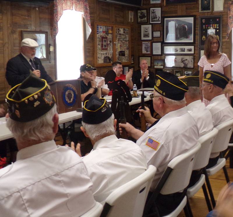 David Raikes introduces Debbie Sampson, sister of Spc. Norman Treest during the Memorial Dedication Ceremony on Monday, May 29, 2023, at the Marseilles American Legion.