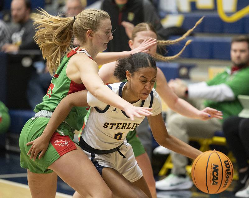 Sterling’s Alivia Gibson works against LaSalle-Peru’s Margaret Boudreau Tuesday, Dec. 3, 2024, at Sterling High School.