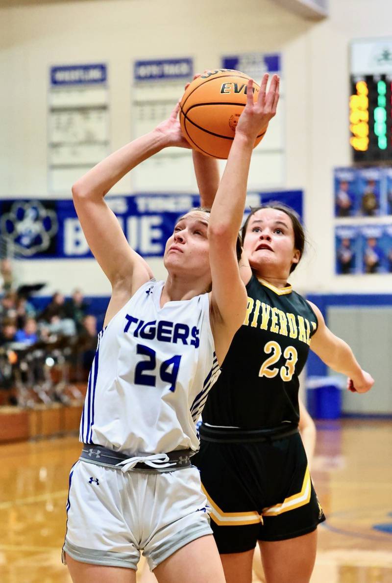 Princeton's Keighley Davis shoots in front of Riverdale's Cayleigh Murray Tuesday night at Prouty Gym.