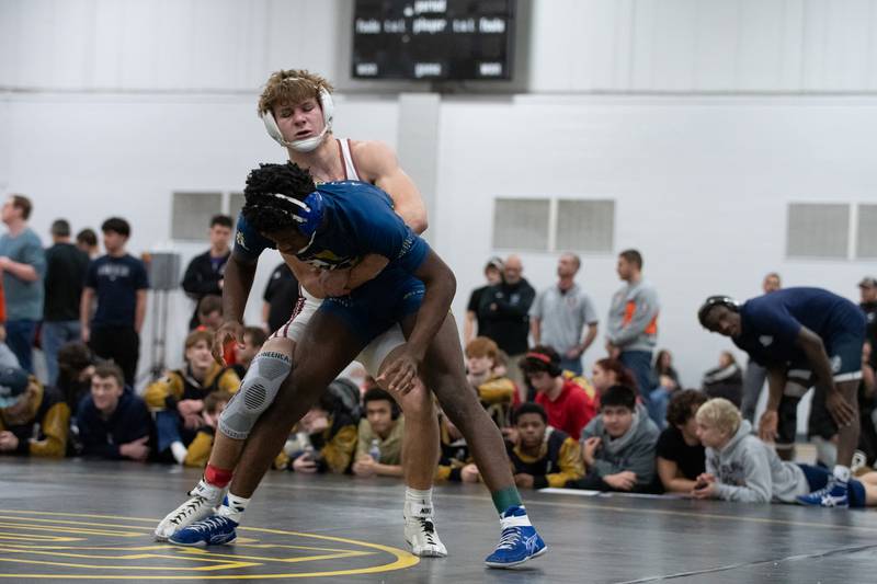 Wheaton Academy's Tyler Jones, top, and Altoff Belville's Pierre Walton wrestle in the 165-pound championship match during the Reed-Custer Comet Classic Wrestling Invite on Saturday, Jan 17.