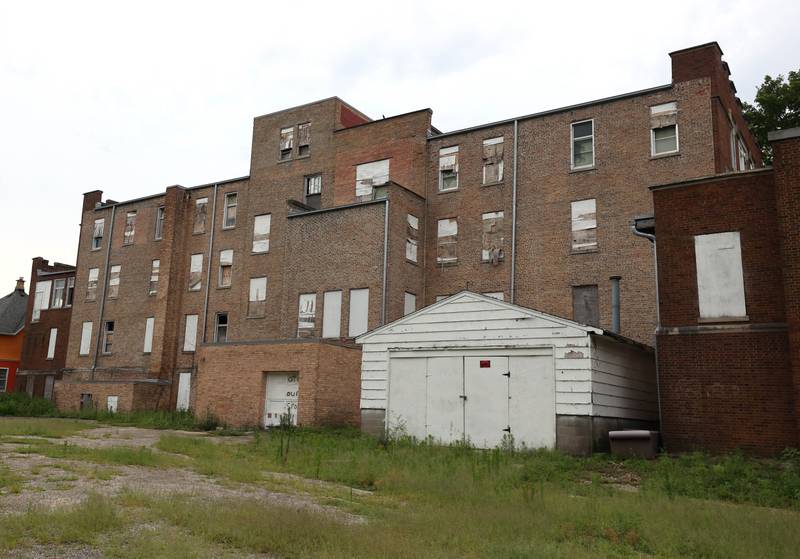 The back of the long-vacant former St. Mary’s Hospital at 145 Fisk Ave. on Wednesday, July 30, 2025, in DeKalb.