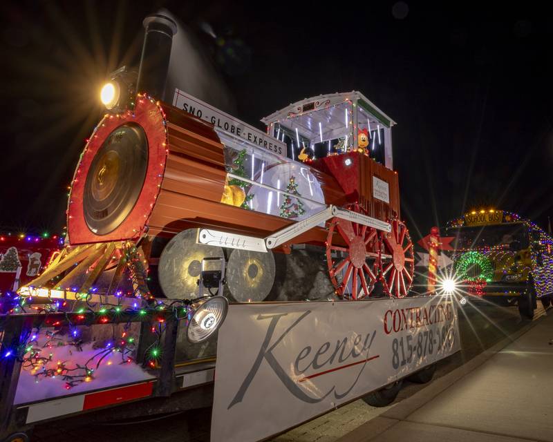 The "Sno Globe Express", one of the floats entered in the parade by Keeny Contracting, had a switch that would allow a fog machine located inside the pipe to provide additional smoke effects.