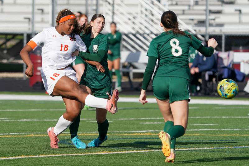 Oswego’s Jordyn Washington (18) shoots the ball for a goal against Bartlett during a soccer mach in the Plainfield Classic  at Plainfield North High School on Tuesday, April 15, 2025.