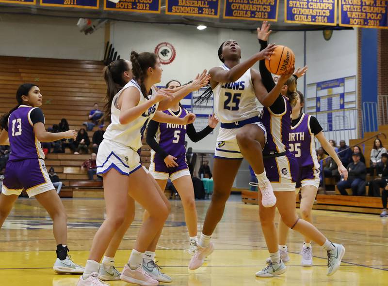 Lyons' Nora Ezike (25) puts up a shot during the girls varsity basketball game between Downers Grove North and Lyons Township on Saturday, Jan. 11, 2025 in La Grange.
