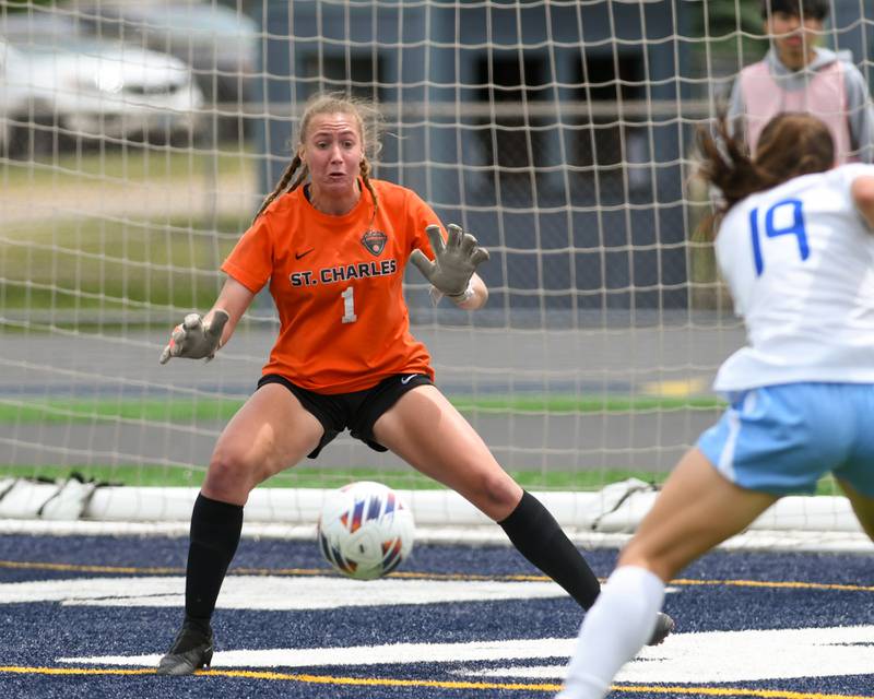 St. Charles East goal keeper Sidney Lazenby (1) saves the ball from going into the back of the net on Saturday May 27th during the sectional title game held at West Chicago Community High School.