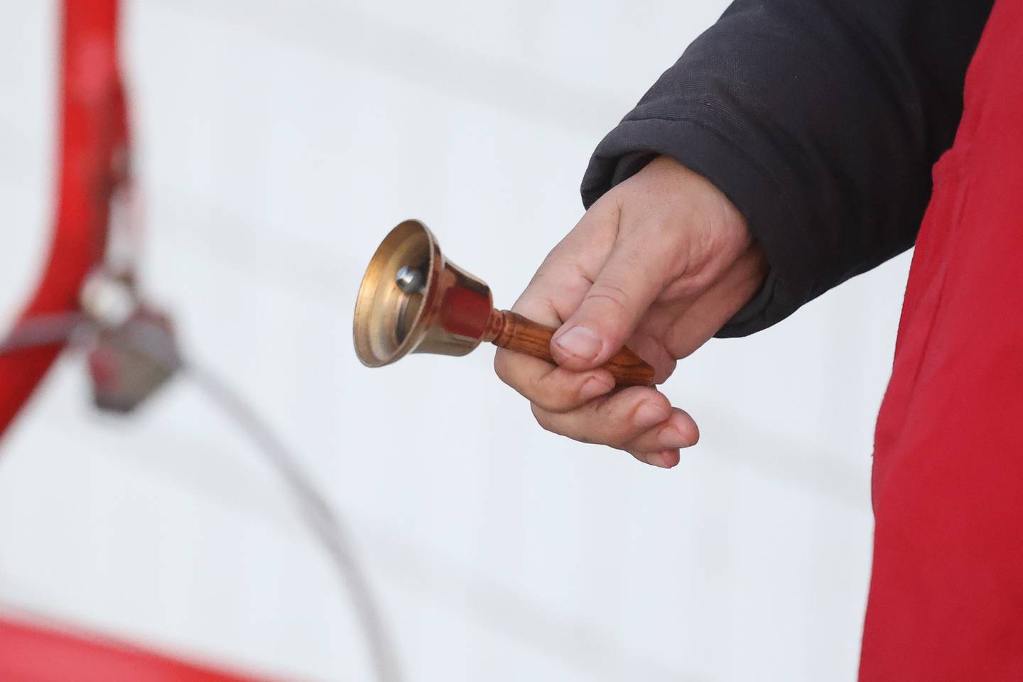 A volunteer rings the bell for the Salvation Army outside Hobby Lobby on Wednesday, Nov. 29, 2023 in Joliet.