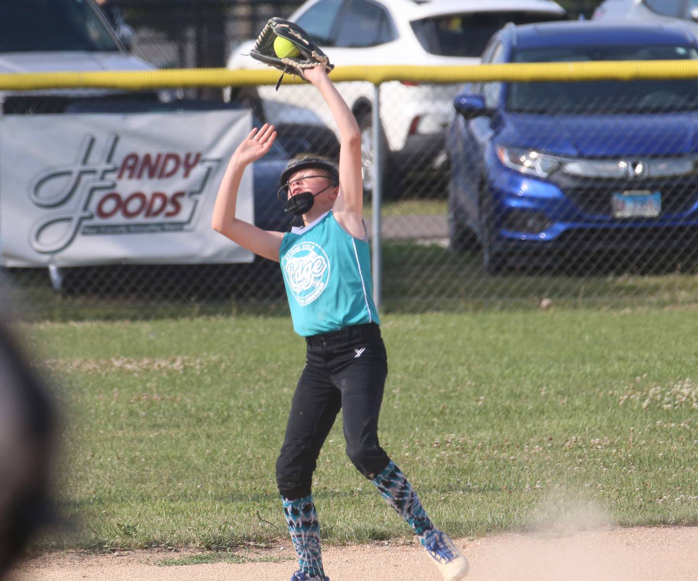 Edge's Eden Weems makes a catch at short stop during the Ottawa Girls Fastpitch Association 11U City Championship on Wednesday July 2, 2025 at Peck Park in Ottawa.