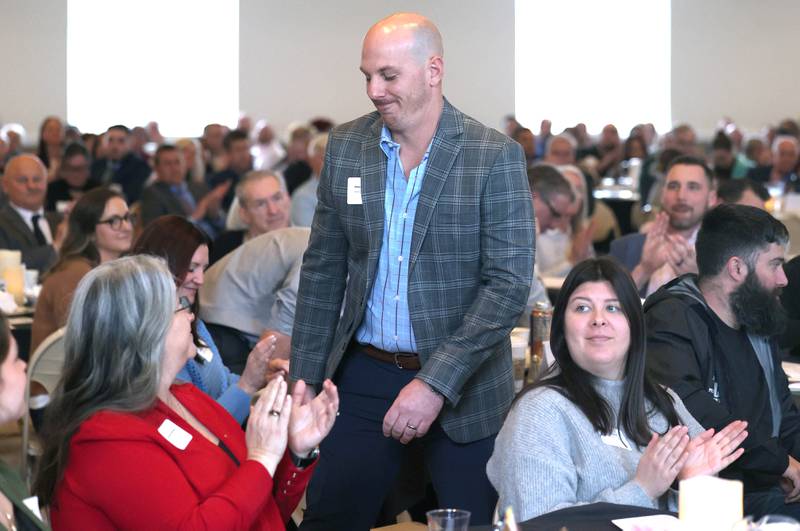 Chase Goodeill is introduced as his business Pest Control Consultants is presented with the Spirit of Small Business Award during the 107th Annual Sycamore Chamber of Commerce Meeting Thursday, March 7, 2023, in Memorial Hall at St. Mary's Catholic Church in Sycamore.