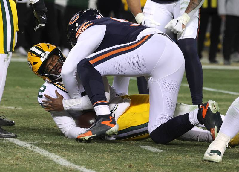 Chicago Bears defensive end Montez Sweat sacks Green Bay Packers quarterback Malik Willis late in the fourth quarter Saturday, December 20, 2025, during their game at Soldier Field in Chicago.