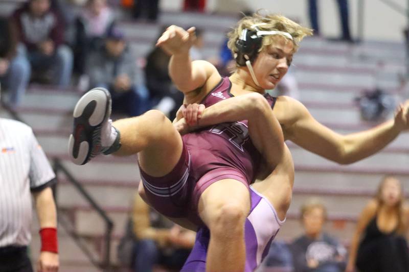 Prairie Ridge’s Jacob Meade is thrown by Hampshire’s Jasper Hintz at 165 pounds in varsity boys wrestling on Thursday, Dec. 4, 2025, at  Prairie Ridge High School in Crystal Lake.