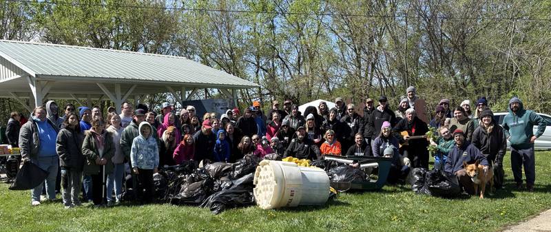 Organizers and volunteers pose for a group photo during the 10th annual Perfectly Flawed Earth Day cleanup at the I&M Canal’s Lock 14 on Saturday, April 18, in La Salle.