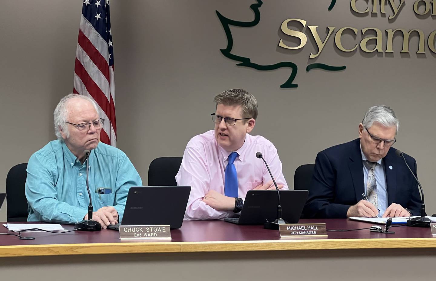 A long time incumbent running unopposed in the April 4 election, Second Ward Alderman, Chuck Stowe, left, looks at his computer while City Manager, Michael Hall, middle talks about a pair of requests to annex DeKalb County enclaves surrounded by Sycamore properly into the city. City Attorney, Kieth Foster, right, takes notes while Hall talks on Feb. 6, 2023.