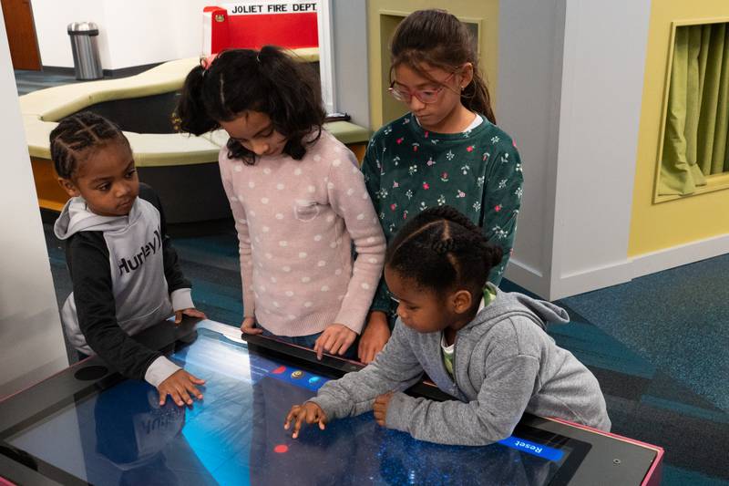 The Joliet Public Library at 150 N. Ottawa St. in Joliet is hosting an all-ages, interactive Exoplanet exhibit from NASA through Feb. 28. Pictured are Marlon Needon, Merda Ramirez, Miranda Espina and Cameron West.
