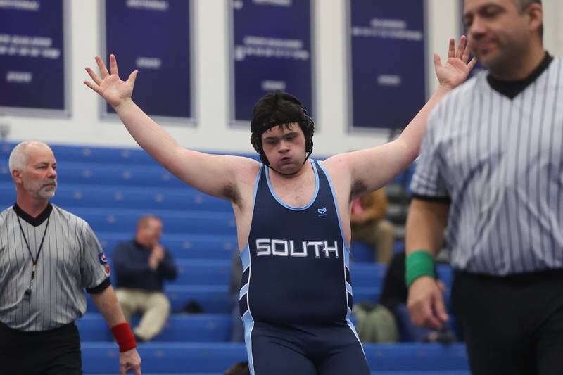 Plainfield South’s Ian Portillo celebrates a win over Plainfield North’s Liam Corona in a Southwest Prairie dual meet on Wednesday, Nov. 29, 2023 in Plainfield.