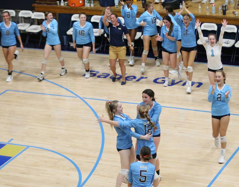 Members of the Marquette volleyball team celebrate after defeating Hall on Monday, Sept. 25, 2023 at Bader Gym.