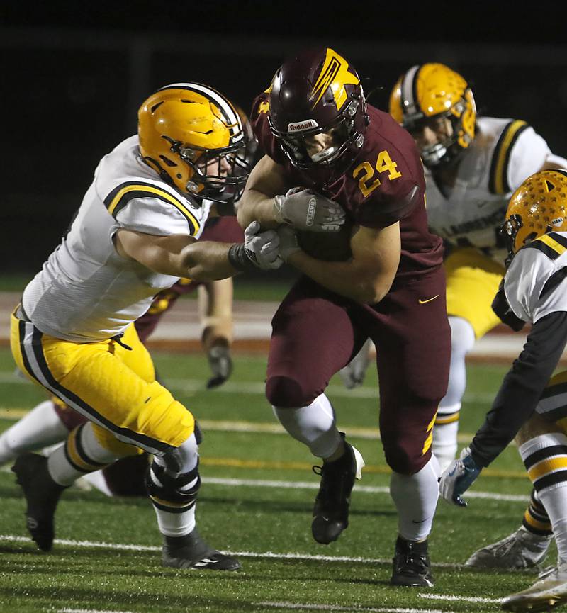 Richmond-Burton's Hunter Carley tries to run through the St. Laurence defense during an IHSA Class 4A first-round football game on Friday, Nov. 1, 2024, at Richmond-Burton High School in Richmond.