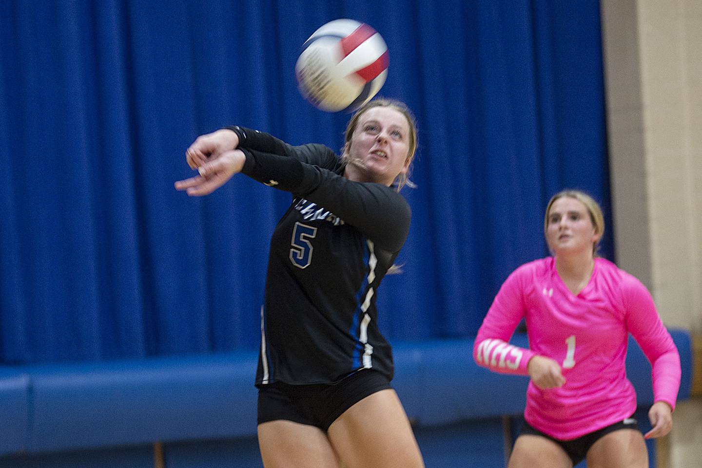 Newman’s Molly Olson plays a shot against Dixon Monday, Aug. 29, 2022.