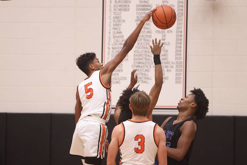 Lincoln-Way West’s Daniel Reniguntala blocks a shot against Lincoln-Way East.