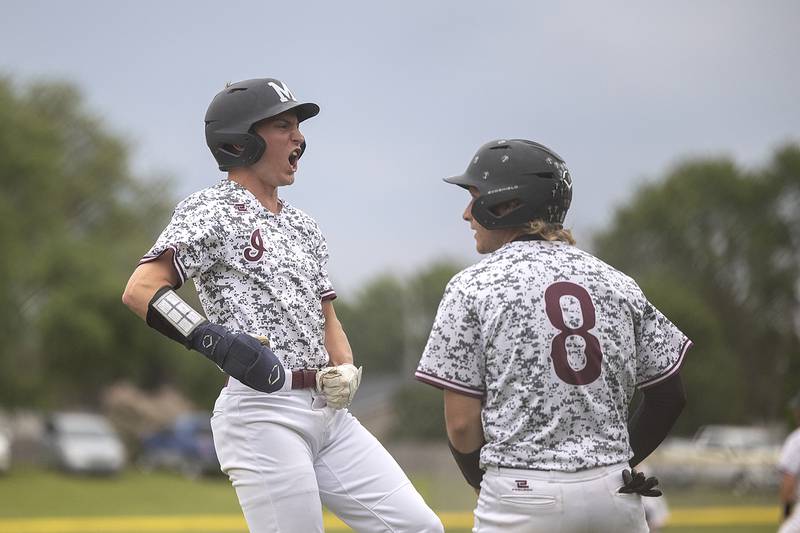 Marengo’s Alten Bergbreiter (left) and Quinn Lechner celebrate scoring against Newman Wednesday, May 28, 2025, in the Class 2A Sectional semifinal in Mendota.