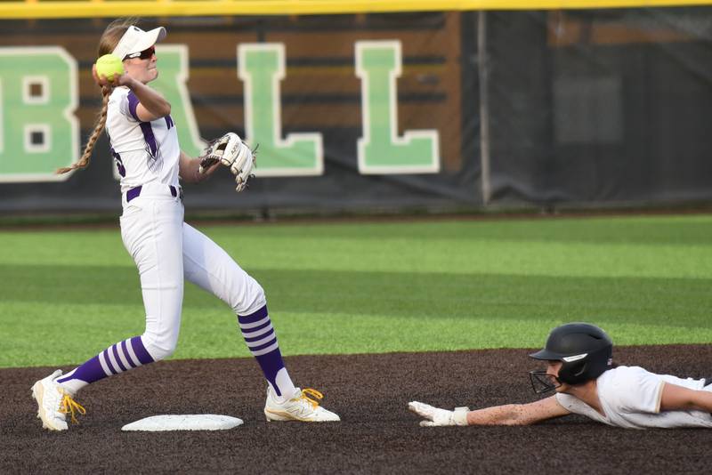 Wilmington's Keeley Walsh, left, throws to first after forcing Bishop McNamara's Camille Czako out at second base during the Class 2A Seneca Regional semifinals Tuesday, May 19, 2026.