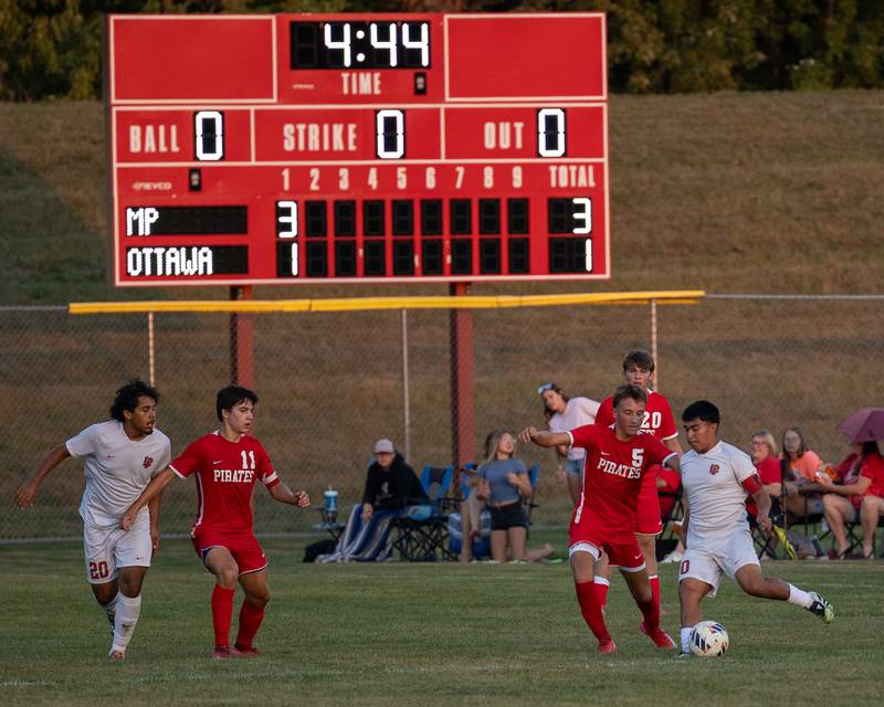 (from left) Rory Moore (5) of Ottawa plays defense on Ismael Mejia (10) of L-P on Wednesday, Sept. 17, 2025 at Ottawa High School in Ottawa.