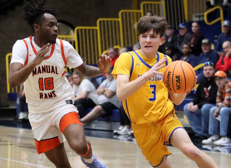 Johnsburg’s Trey Toussaint, right, drives against against Peoria Manual’s Jaquan Brown in boys IHSA Class 2A Supersectional basketball on Monday, Mar. 9, 2026, at Sterling High School in Sterling.