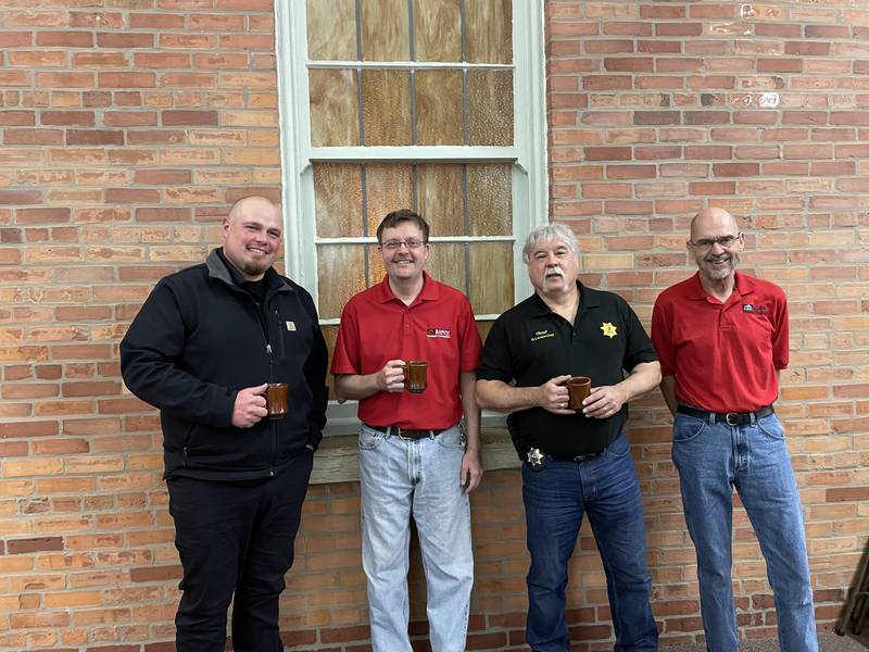 (Left to right) Seneca Mayor Jeff Olson, Illinois River Area Chamber President Ed Callahan, retired police officer Bob Maddox and chamber member Ernest McGeorge share a cup of coffee during the Coffee with a Cop event hosted by the chamber.