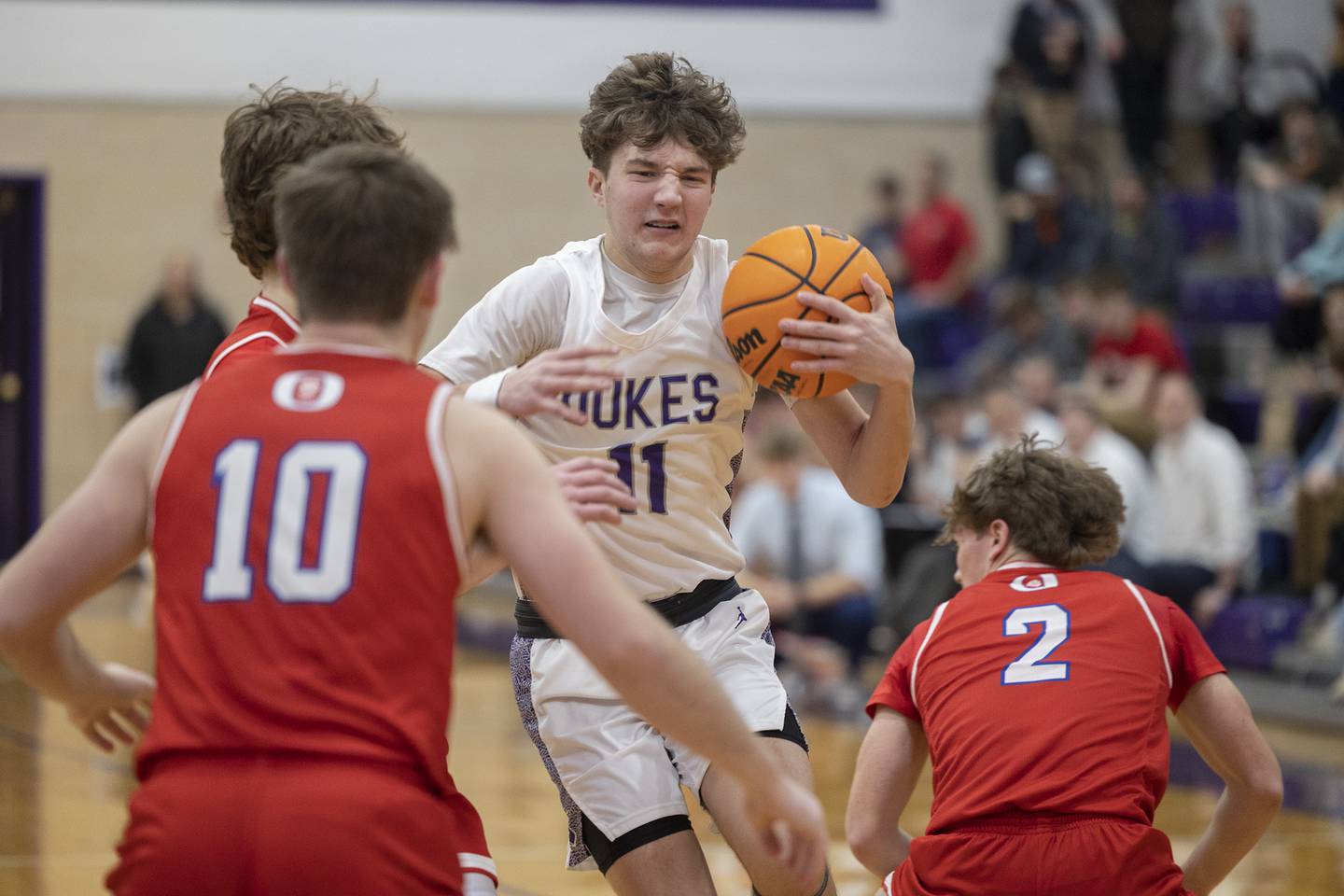 Dixon’s Brody Nicklaus handles the ball in traffic against the Oregon defense Tuesday, Feb. 3, 2026.