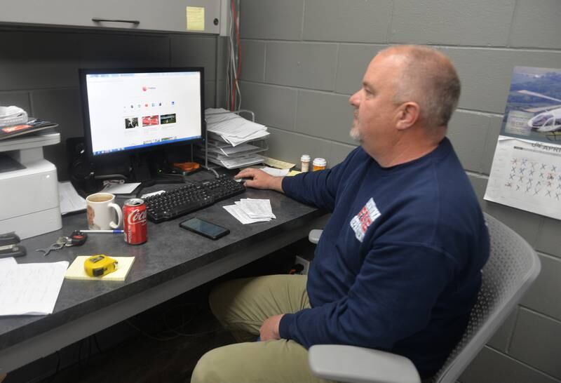 Savanna Fire Scott Wolfe gets ready to check National Weather Service data on Sunday as the department monitored the rising Mississippi River after it reached the 21-foot mark Saturday night. Wolfe is the only full time firefighter for the department which is comprised of 37 volunteers. Firefighters have been woking around the clock the past several days to try and mitigate floodwaters as the river continued to rise.