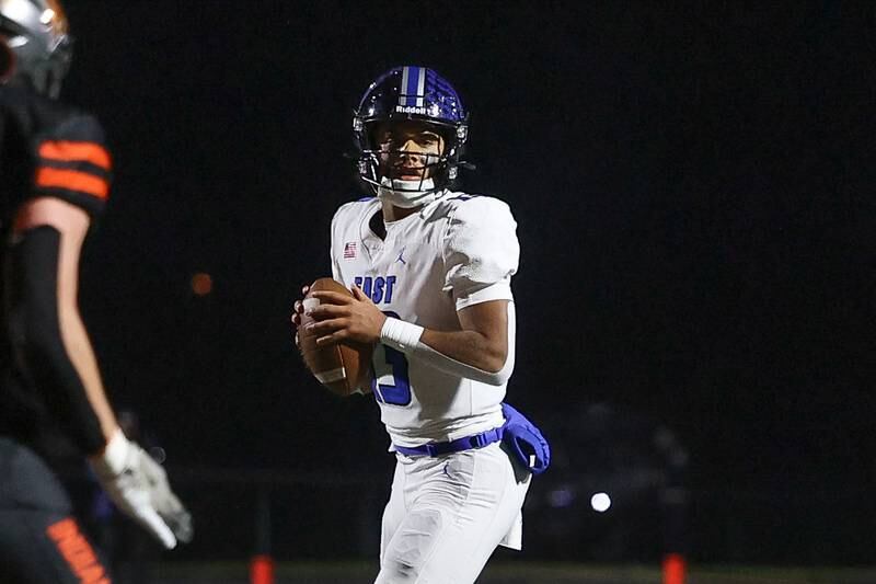 Lincoln-Way East’s Jonas Williams looks to pass against Minooka on Friday, Nov. 8, 2024 in Minooka.