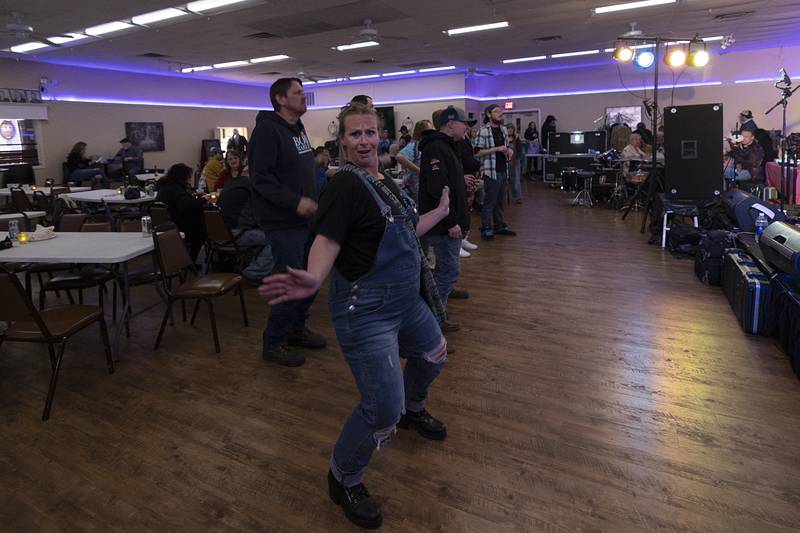 Kendra Rogers of Polo dances to her husband’s band Mr. Grimm and the Bad Luck, Saturday, March 9, 2024 at the Save Rosbrook fundraiser.