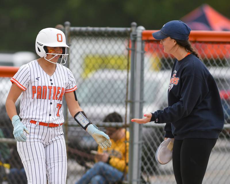 Oswego's Ellalina Mahoney (7) gets congratulated by Oswego's head coach Annie Scaramuzzi during the regional final game against Benet Academy on Friday May 22, 2026, while being played at Oswego High School.