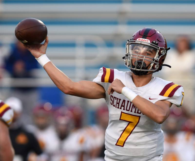 Joe Lewnard/jlewnard@dailyherald.com
Schaumburg quarterback Lucas Wagener throws a pass during Friday’s game at Maine West.
