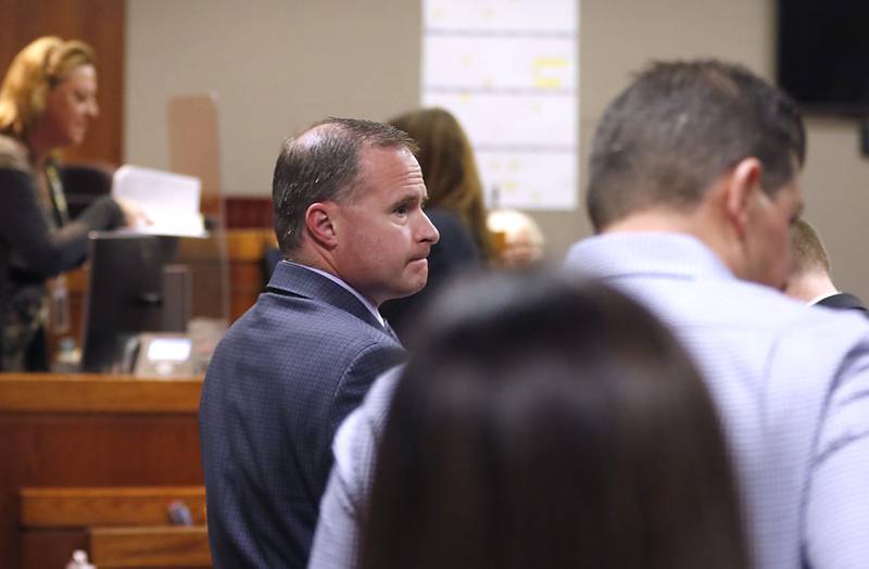 William Bishop looks back at the people in the gallery during a break in his bench trial before McHenry County Judge Michael Coppedge on Monday, Oct. 17, 2022, in the McHenry County courthouse in Woodstock.