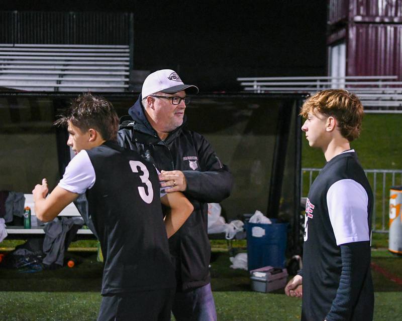 Prairie Ridge’s athletic director Chris Shremp congratulates the boy’s soccer team after winning the super sectional game against Benet Academy during the class 2A super sectional soccer match on Tuesday Nov. 5, 2024, held at Wheaton Academy in West Chicago.