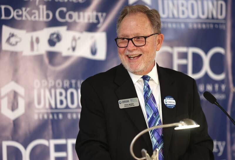 Paul Borek, Executive Director and Enterprise Zone Administrator for the DeKalb County Economic Development Corporation, smiles Thursday, April 28, 2022, at Faranda's Banquet Center in DeKalb as he gives an update on the development growth in the county over the past year. Borek was speaking during the annual DCEDC dinner and state of the county event.