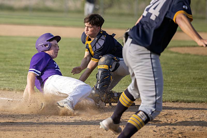 Sterling’s Ayden Schoon tags out Rochelle’s Dylan Gapski in class 3A regional action on Monday, May 22, 2023.