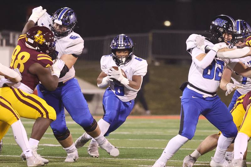 Lincoln-Way East’s Nuri Muhammad finds a hole on a run against Loyola in the Class 8A championship on Saturday, Nov. 25, 2023 at Hancock Stadium in Normal.