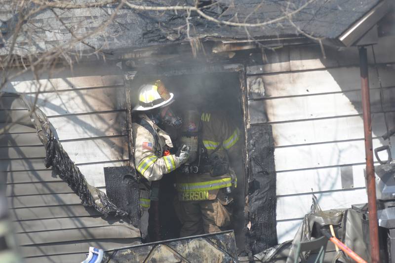 Firefighters work inside a home at 2010 S. Second St., in Daysville on Wednesday, March 12, 2025.
