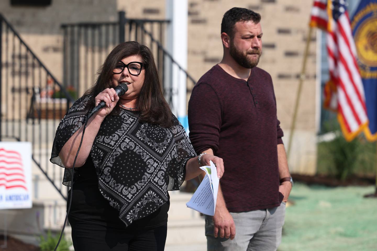 Nicole Murray, Will County Habitat for Humanity Executive Director, left, stands with Army veteran Joe Murdie at the Will County Habitat for Humanity official presentation of Murdie’s new home on Saturday, June 17, 2023 in Crest Hill.