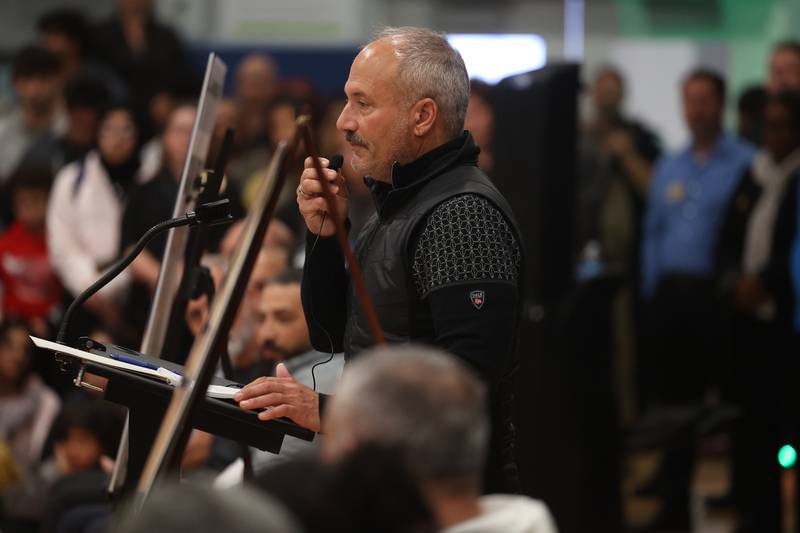 Plainfield Village President  John Argoudelis shares a few words at a vigil for Wadea Al-Fayoume at Prairie Activity & Recreation Center on Tuesday, Oct. 17, 2023 in Plainfield.