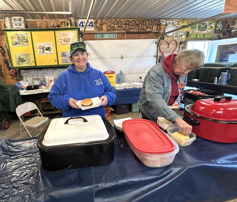 Lisa Hinrichs (left) and Betty Mull work in the concession stand at The 16th Annual AJ’s Garden Tractor Jamboree on Saturday, May 17, 2025. The event is held on the Hinrichs farm at 1675 S. Columbian Rd., Oregon.