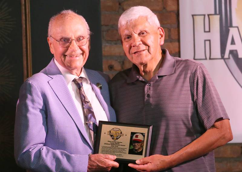 John Cruz, a legendary area baseball coach and recipient of the Lanny Slevin Lifetime Achievement Award poses with emcee Lanny Slevin during the 2025 Shaw Media Illinois Valley Sports Hall of Fame at the Auditorium Ballroom in La Salle.