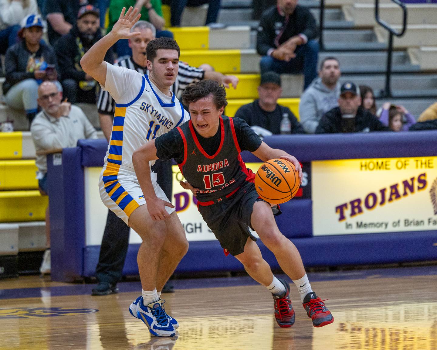 Luke Baumann (15) of Aurora Christain dribbles ball past Johnsburg's Ryan Franze (11) during the Class 2A Boys Sectional Basketball tournament game on Wednesday, March 4, 2026 at Mendota High School.